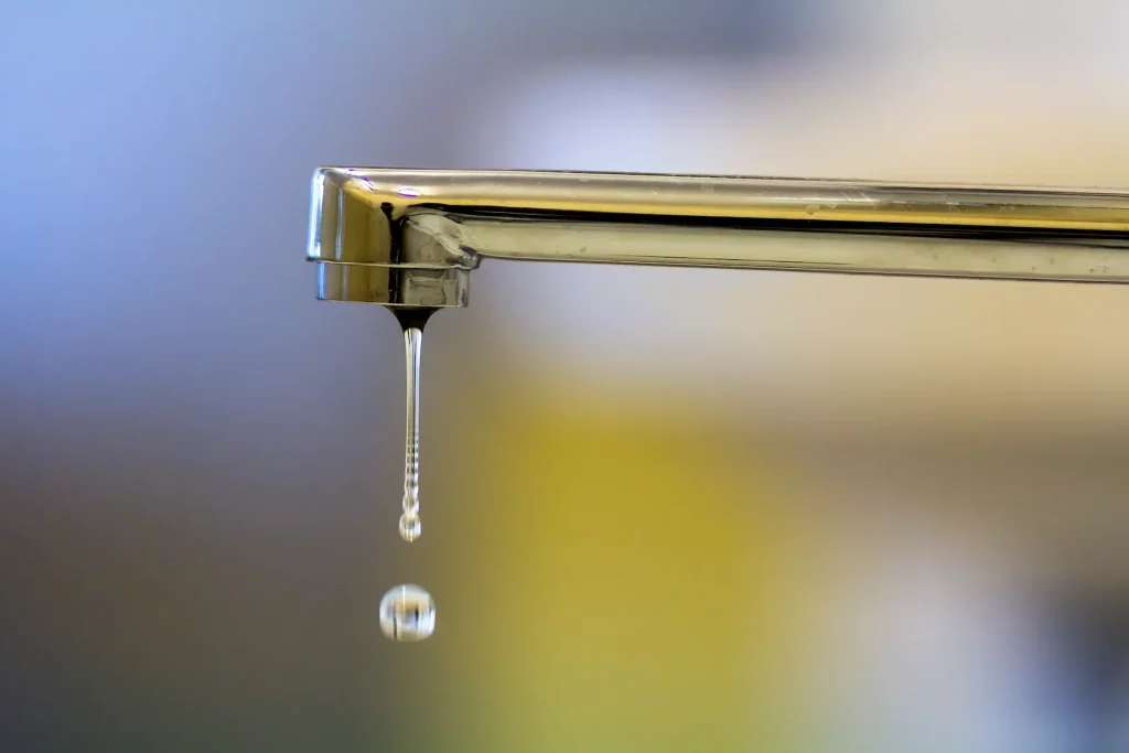 close-up-of-faucet-with-turned-drop-water faucet repair