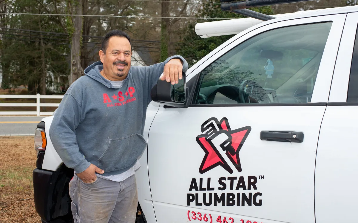 All-Star Plumbing technician installing water treatment equipment in Winston-Salem NC